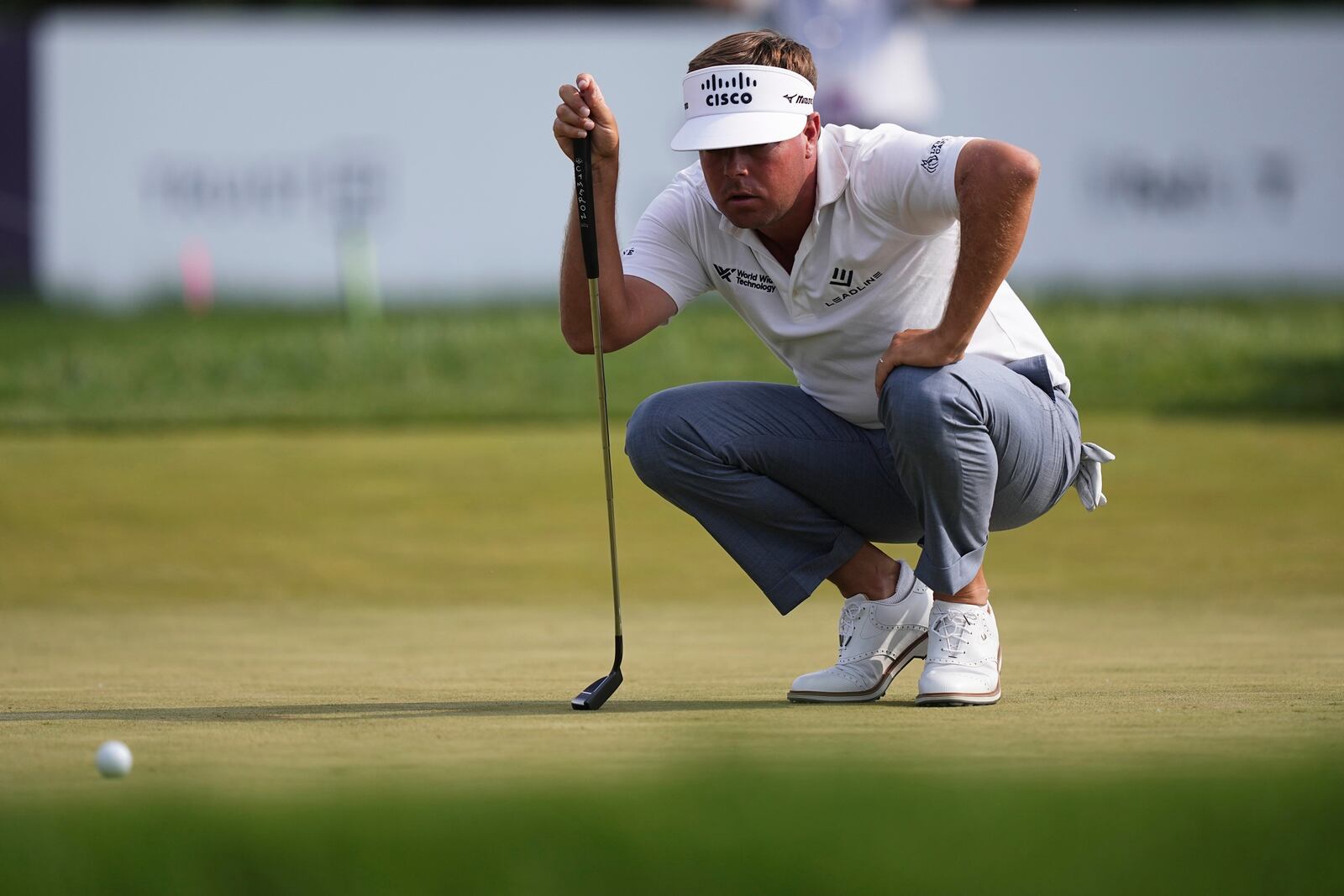 Keith Mitchell lines his putt on the ninth hole during the first round of the Truist Championship golf tournament at the Philadelphia Cricket Club, Thursday, May 8, 2025, in Flourtown, Pa. (AP Photo/Matt Rourke)