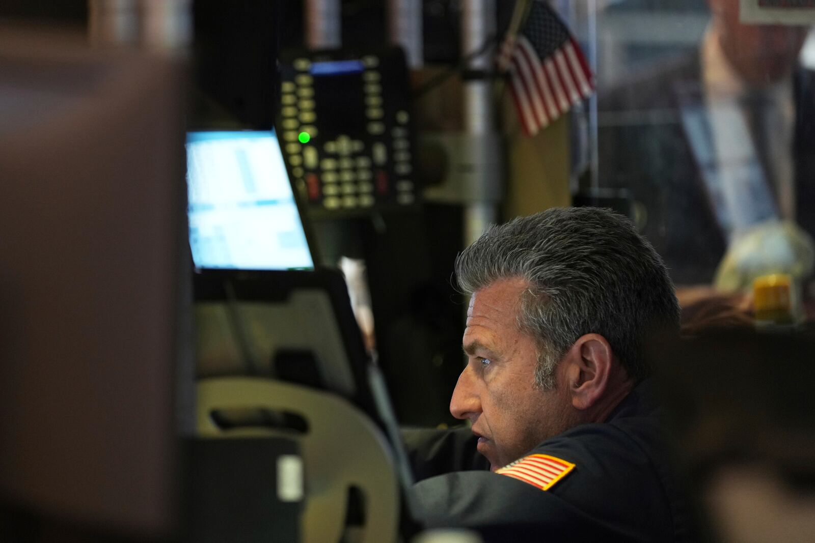 Traders work on the floor at the New York Stock Exchange in New York, Monday, April 7, 2025. (AP Photo/Seth Wenig)