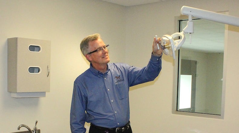 Rocking Horse Community Health Center CEO, Kent Youngman inspects one of the new dental work areas. JEFF GUERINI/STAFF