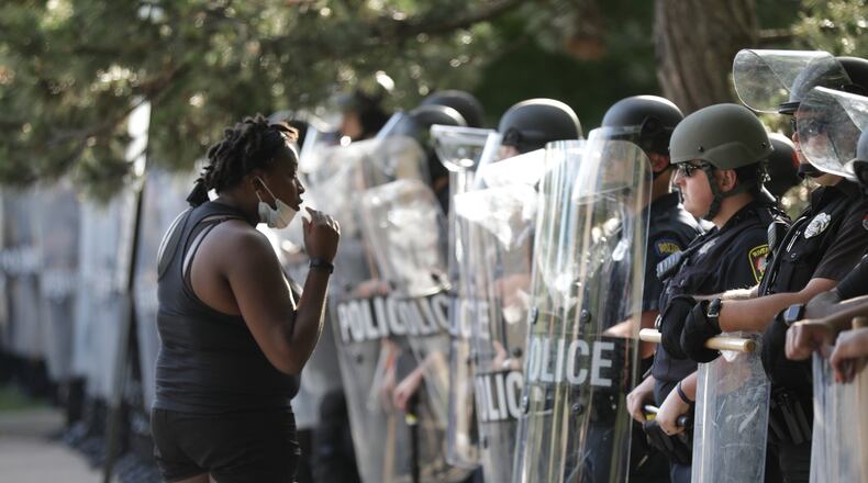 Protests continued throughout the day Saturday in response to the death of George Floyd, an unarmed black man who died in police custody in Minneapolis. STAFF PHOTO BILL LACKEY