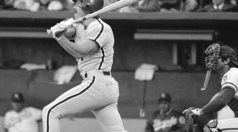 FILE - In this Oct. 19, 1980, file photo, Philadelphia Phillies' Mike Schmidt watches his two-run homer in the fourth inning as Kansas City Royals catcher Darrell Porter watches, at right, during Game 5 of the World Series in Kansas City. (AP Photo/Stubblebine, File)