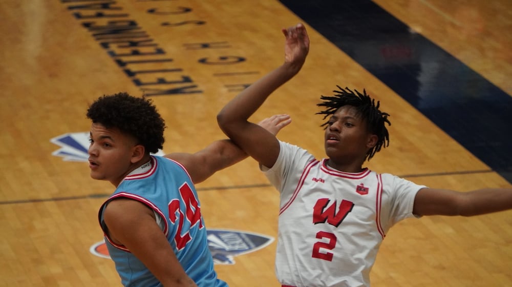 Lakota West's Joshua Tyson (2) puts up a shot over Fairmont's Jayden McGraw (24) at the 22nd Annual The Beacon Orthopedics Flyin’ to the Hoop Invitational on Monday, Jan. 20, 2025 at Trent Arena. CHRIS VOGT / CONTRIBUTED