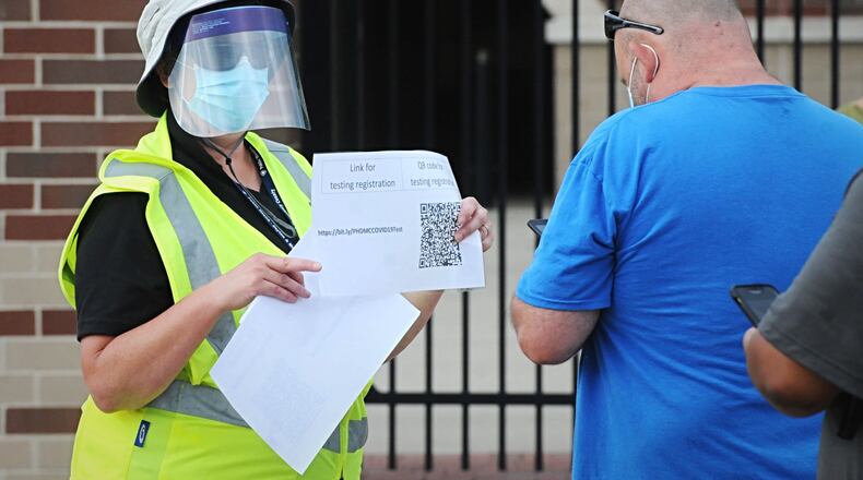 People lined up outside the Rose Music Center for coronavirus testing in July 2020. MARSHALL GORBY \STAFF FILE