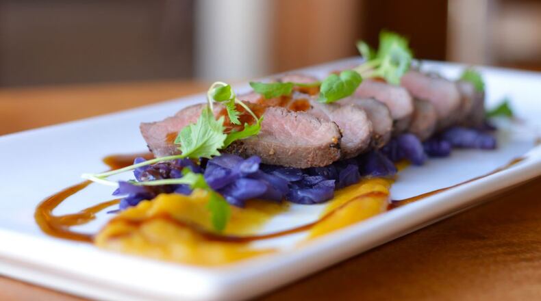 The Golden Lamb s pan roasted lamb loin with braised red cabbage, roasted acorn squash with a port reduction was one of several entrees on the historic restaurant's Bounty of the Fall Harvest menu in 2015.