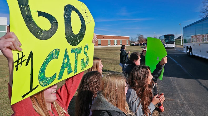 Roosevelt Middle School and Simon Kenton Elementary students line the street to cheer on the Springfield Wildcats football team as they leave Thursday, Nov. 2, 2022 for their State Championship game in Canton. BILL LACKEY/STAFF
