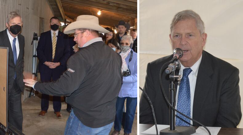 Left: U.S. Department of Agriculture Secretary Tom Vilsack (left) looks on as Andy Korb shows the plans for a meat processing building he is planning for the site on College Corner Pike. Vilsack was there for the announcement of a $100 million federal loan guarantee program to improve the food supply chain.
RIGHT: U.S. Department of Agriculture Secretary Tom Vilsack speaks to the media about the new loan guarantee program he announced on the local farm of Andy and Jessica Korb, who are planning a meat processing facility there. CONTRIBUTED/BOB RATTERMAN