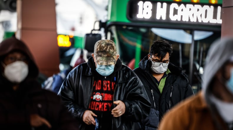 The RTA Hub on Main St. was busy on Wednesday with people coming and going to work. The Greater Dayton Regional Transit Authority announced it will temporarily reduce service because of rising absences likely due to COVID and lower ridership during the public health crisis. JIM NOELKER/STAFF