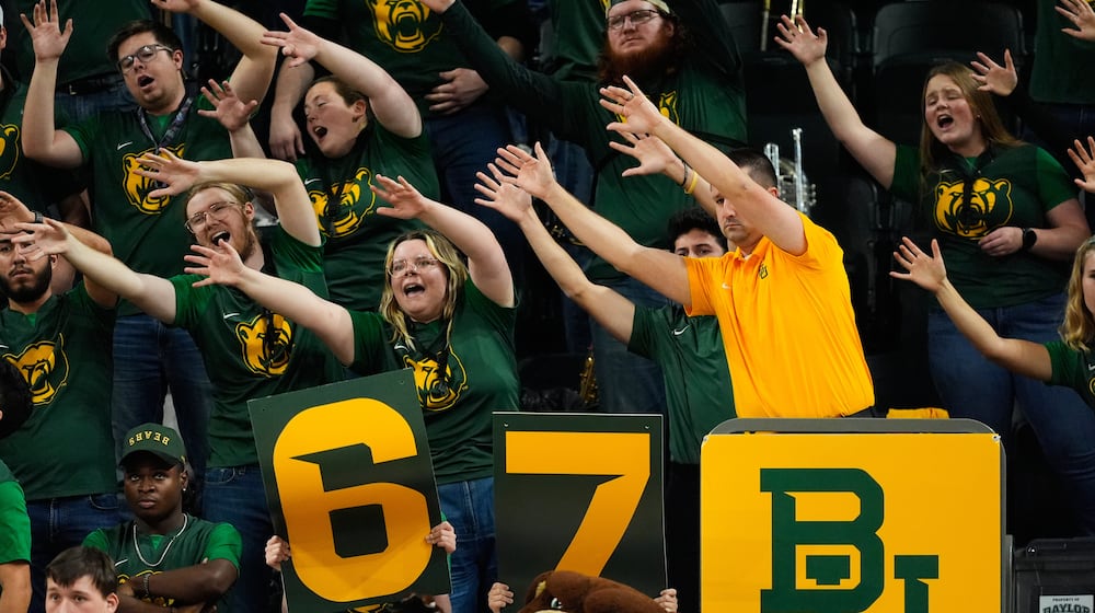 FILE - Baylor fans holding up a 6-7 sign cheer during an NCAA college basketball game against BYU, Feb. 10, 2026, in Waco, Texas. (AP Photo/Tony Gutierrez, file)