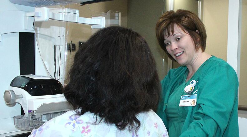 Selena Kemper, mammography supervisor at Springfield Regional Imaging Center explains the breast screening process in the MERCY HEALTH 3D mobile mammography vehicle. JEFF GUERINI/STAFF