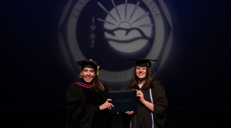Lanna Kunzelman with Clark State President Dr. Jo Alice Blondin as she receives her associate's degree. CONTRIBUTED