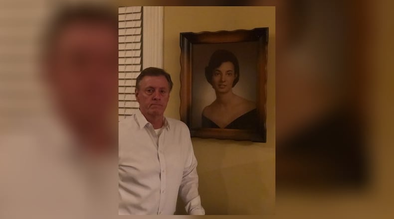 Aaron Taylor with a picture of his mom, Anita Taylor.