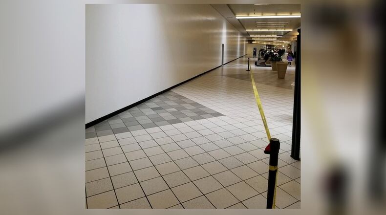 A long white wall in the Sears wing of the Dayton Mall will be the new RoomPlace store.