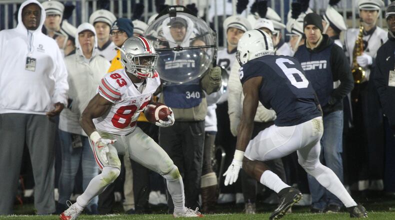 Ohio State’s Terry McLaurin looks for running room after a catch against Penn State on Saturday, Oct. 22, 2016, at Beaver Stadium in State College, Pa. David Jablonski/Staff