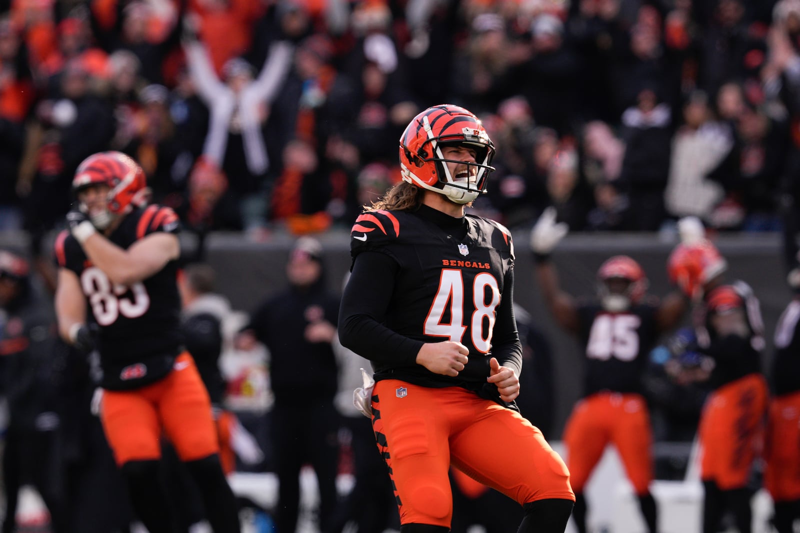 Cincinnati Bengals long snapper Cal Adomitis (48) reacts after a 59-yard field goal was made during the first half of an NFL football game against the Cleveland Browns, Sunday, Dec. 22, 2024, in Cincinnati. (AP Photo/Jeff Dean)