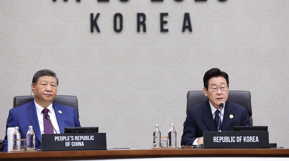 South Korean President Lee Jae Myung, right, speaks next to Chinese President Xi Jinping at the Asia-Pacific Economic Cooperation (APEC) Economic Leaders' Meeting in Gyeongju, South Korea, Saturday, Nov. 1, 2025. (Yonhap via AP)