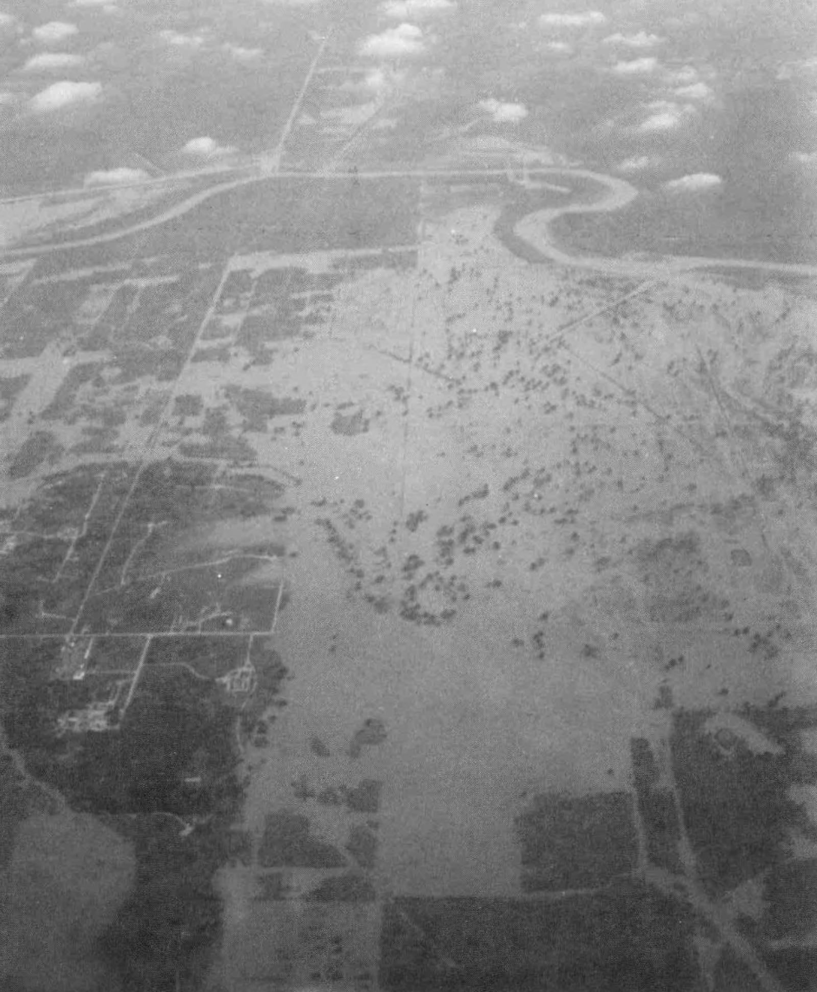 This photo provided by the Fort Bend County Emergency Management Office via NOAA shows flooding from the Brazos River between December 1991 to January 1992. (Mel Speed/Fort Bend County Emergency Management Office via AP)