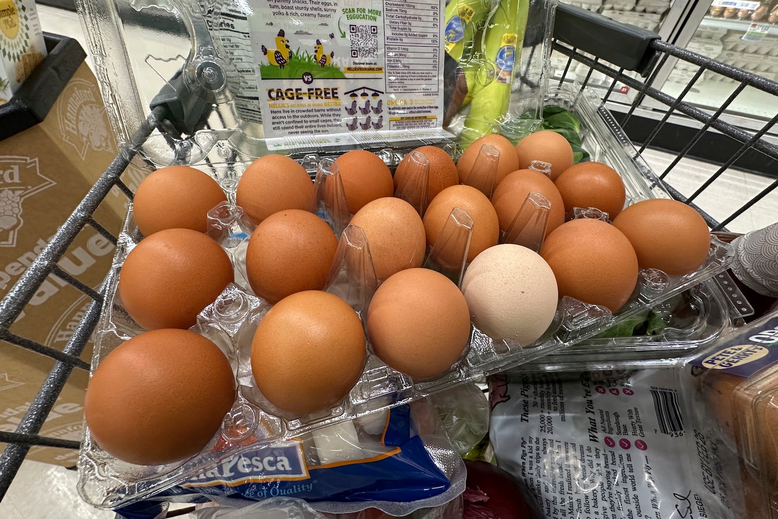 FILE - Eggs sit in a container in a shopping cart at grocery store, Monday, Jan. 27, 2025, in Windham, Maine. (AP Photo/Robert F. Bukaty, File)
