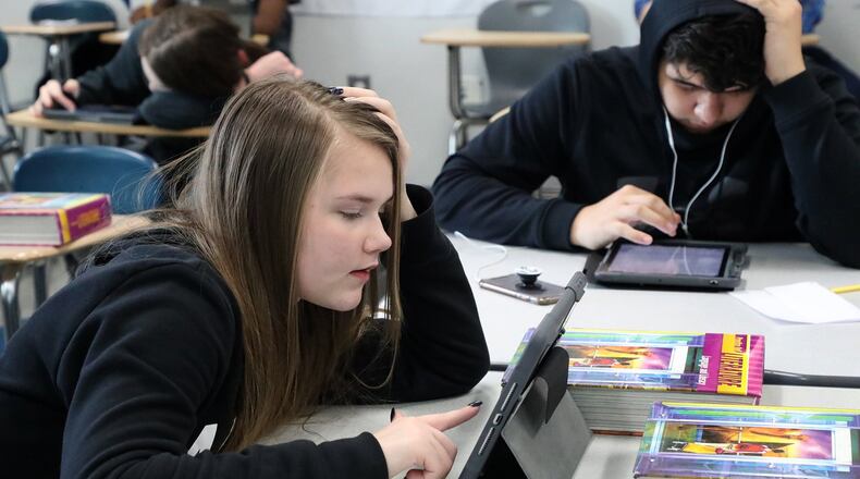 Students at Springfield High School use ipads in class Friday. Students will have to use their ipads to access their school work while they’re off for at least four weeks. BILL LACKEY/STAFF