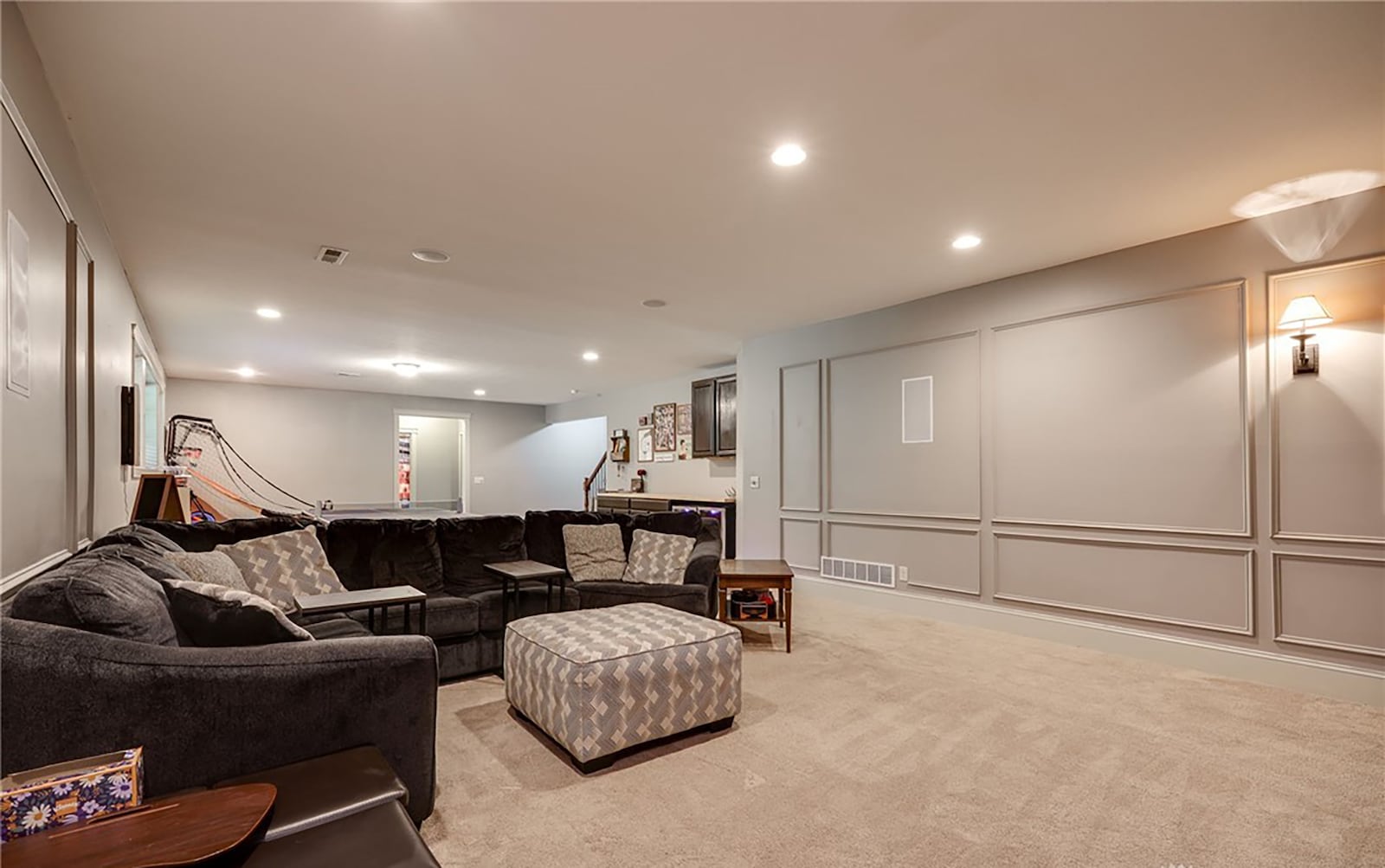 The finished basement has a recreation room with carpeting. It has a wet bar hookup and cabinets and a media area. There is also a full bathroom. CONTRIBUTED