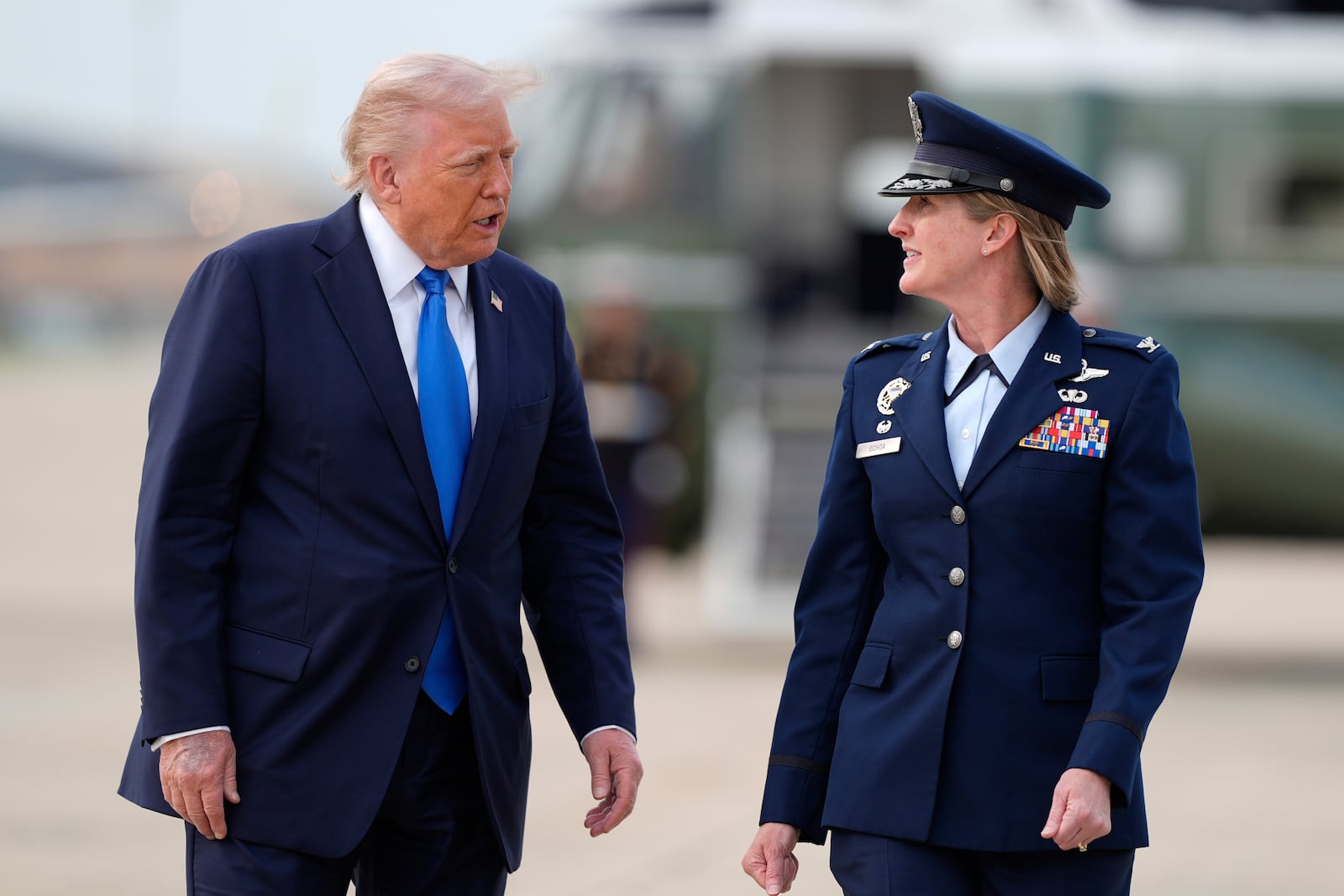 President Donald Trump walks with Air Force Col. Angela Ochoa, Commander of the 89th Airlift Wing from Marine One to board Air Force One at Joint Base Andrews, Md., en route Tuscaloosa National Airport, Thursday, May 1, 2025. (AP Photo/Manuel Balce Ceneta)