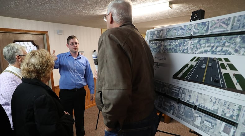 Residents discuss the options for renovating Derr Road Wednesday during a City of Springfield public meeting. BILL LACKEY/STAFF