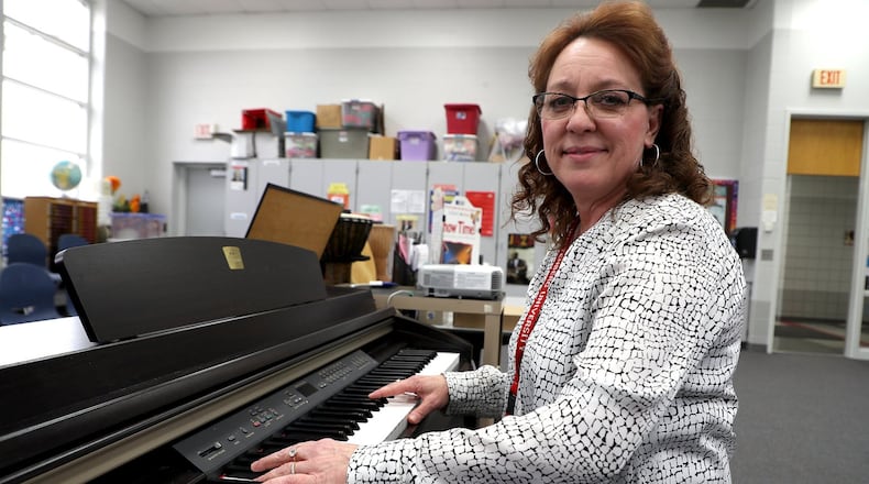 Sharon Safley, at the piano in the music room at Lincoln Elementary. BILL LACKEY/STAFF