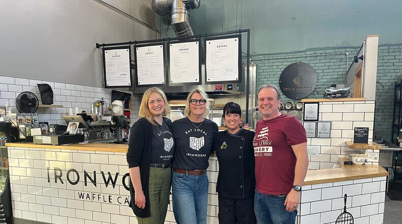 Springfield entrepreneurs Lisa and Dan Freeman, who own Le Torte Dolci Bakery, Salato Deli and Crust & Company, are creating an “umbrella brand” for their businesses as they announce the purchase of Ironworks Waffle Café. Pictured left to right are Ellie and Marcy Nesselroade, who are selling Ironworks, and Lisa and Dan Freeman. CONTRIBUTED