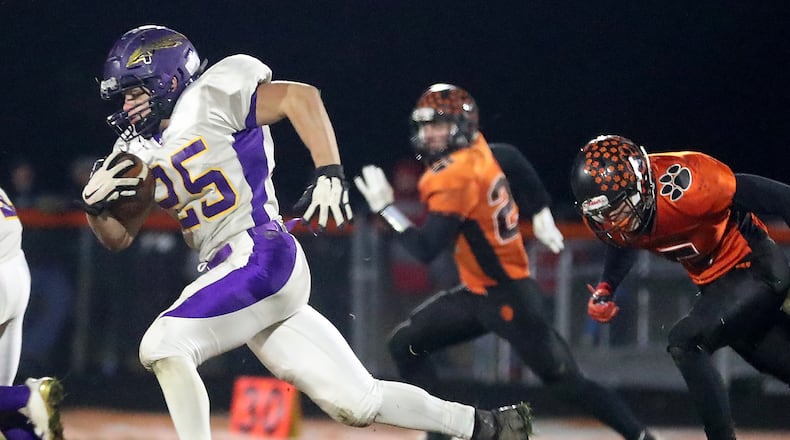 Mechanicsburg’s Chayse Propst breaks into open field as he rushes for a touchdown against West Liberty-Salem earlier this season. The Indians beat Grandview Heights 48-7 Friday to advance to the regional finals. BILL LACKEY/STAFF