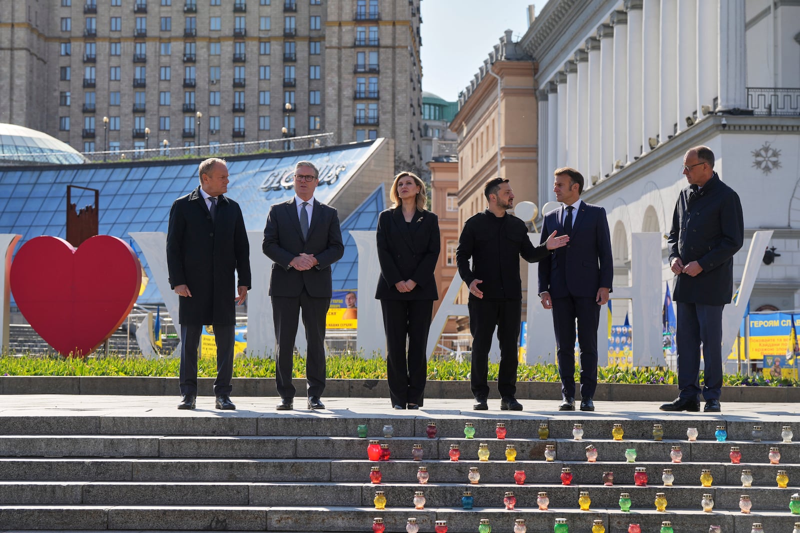 From left, Polish Prime Minister Donald Tusk, U.K. Prime Minister Keir Starmer, Ukraine's First Lady Olena Zelenska Olena Zelenska,Ukrainian President Volodymyr Zelenskyy, French President Emmanuel Macron and German Chancellor Friedrich Merz stand at the memorial of fallen Ukrainian soldiers at independence square during a ceremony for 80th anniversary of VE Day in a memorial park in Kyiv, Ukraine, on Saturday, May 10, 2025. (AP Photo/Evgeniy Maloletka)