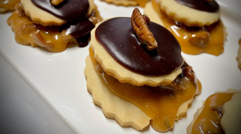 The Dayton Daily News Holiday Cookie Contest returned this year with area bakers submitting nearly 30 of their very best recipes. A panel of judges selected the top three cookies. Pictured are Candy Bar Cookies. NATALIE JONES/STAFF