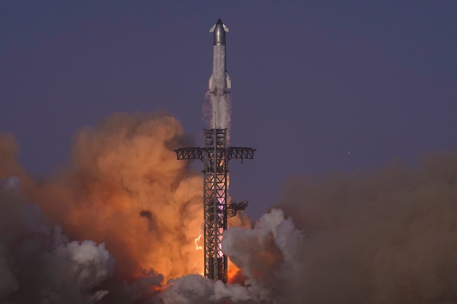 SpaceX's mega rocket Starship makes a test flight from Starbase, Texas, Tuesday, May 27, 2025. (AP Photo/Eric Gay)