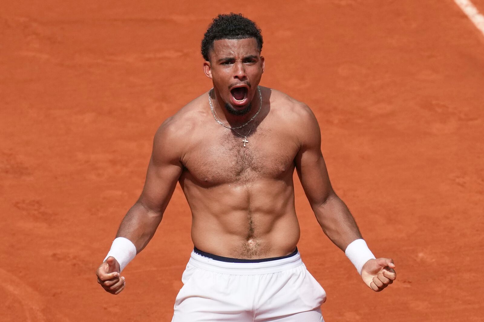 France's Arthur Fils celebrates beating Spain's Jaume Munar after their second round match of the French Tennis Open, at the Roland-Garros stadium, in Paris, Thursday, May 29, 2025. (AP Photo/Christophe Ena)