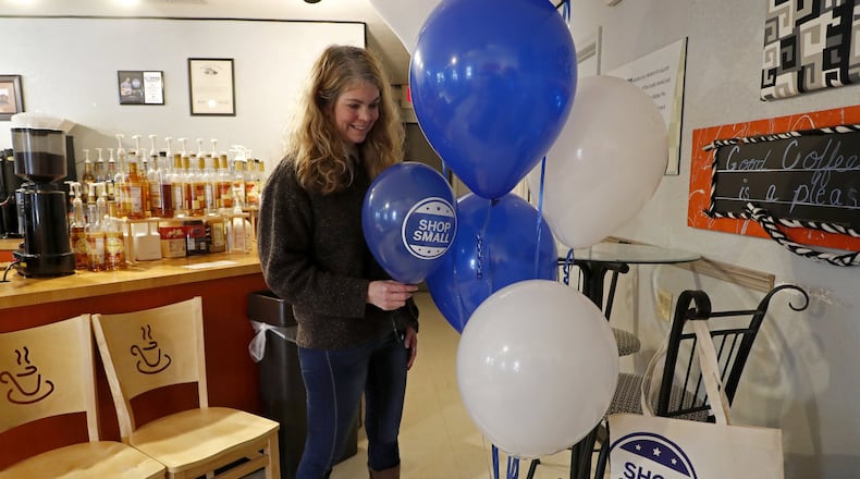 Jacque Evrard, owner of Springfield Balloons LTD, drops off some balloons at Coffee Expressions for Small Business Saturday. Bill Lackey/Staff