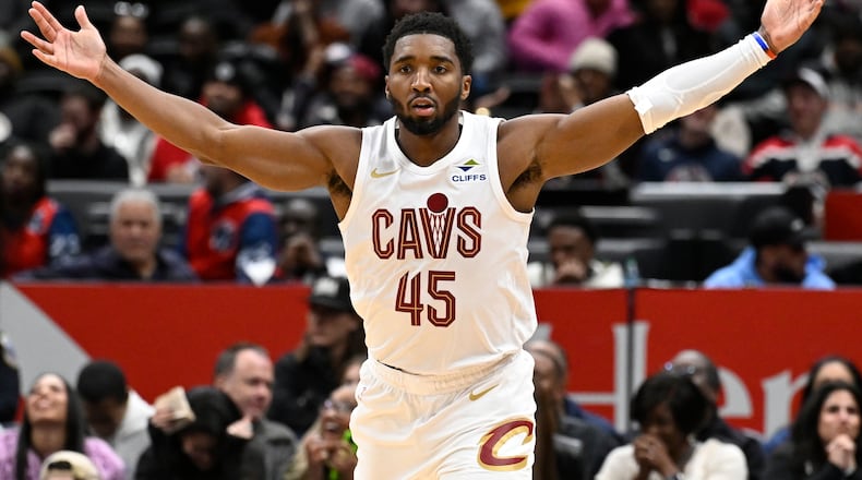 Cleveland Cavaliers guard Donovan Mitchell celebrates after his go-ahead basket late in the second half of an NBA basketball game against the Washington Wizards, Friday, Dec. 12, 2025, in Washington. (AP Photo/John McDonnell)