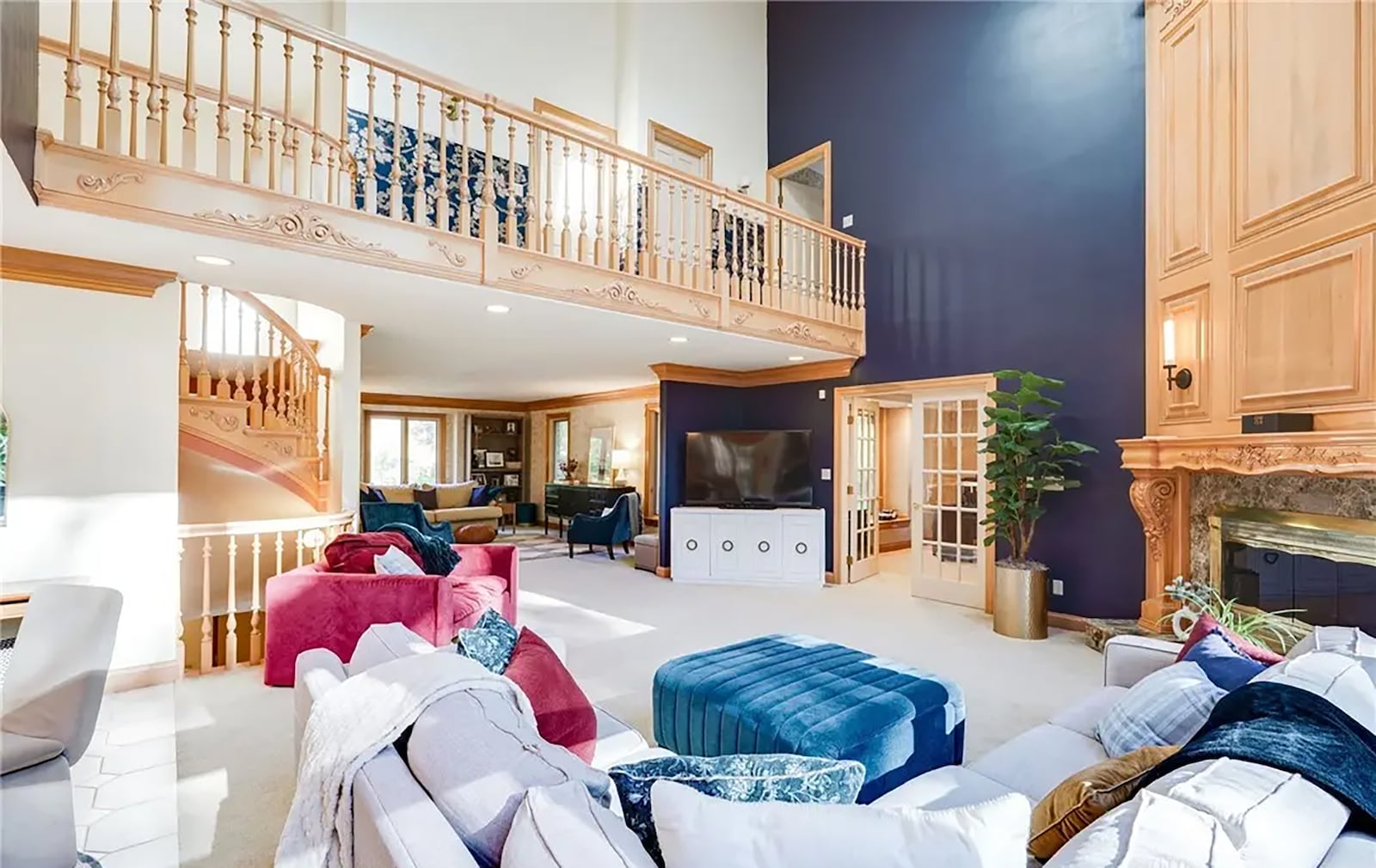 The two story great room has a floor to ceiling fireplace and the second floor catwalk overlooks it. CONTRIBUTED