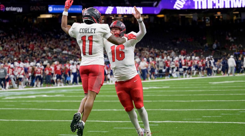 Western Kentucky wide receiver Malachi Corley (11) celebrates his touchdown with Western Kentucky quarterback Austin Reed (16) against South Alabama during the first half of the New Orleans Bowl NCAA college football game in New Orleans, Wednesday, Dec. 21, 2022. (AP Photo/Matthew Hinton)
