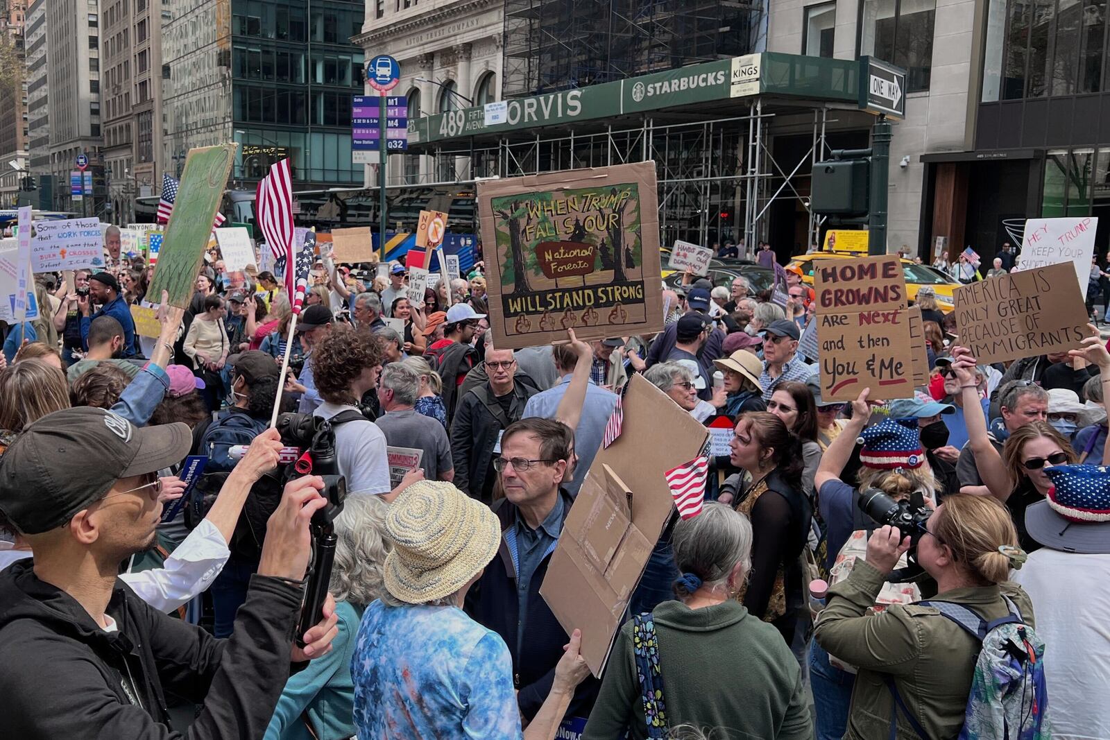 People gather to protest President Donald Trump's policies on Saturday, April 19, 2025 in New York. (AP Photo/Joseph Frederick)