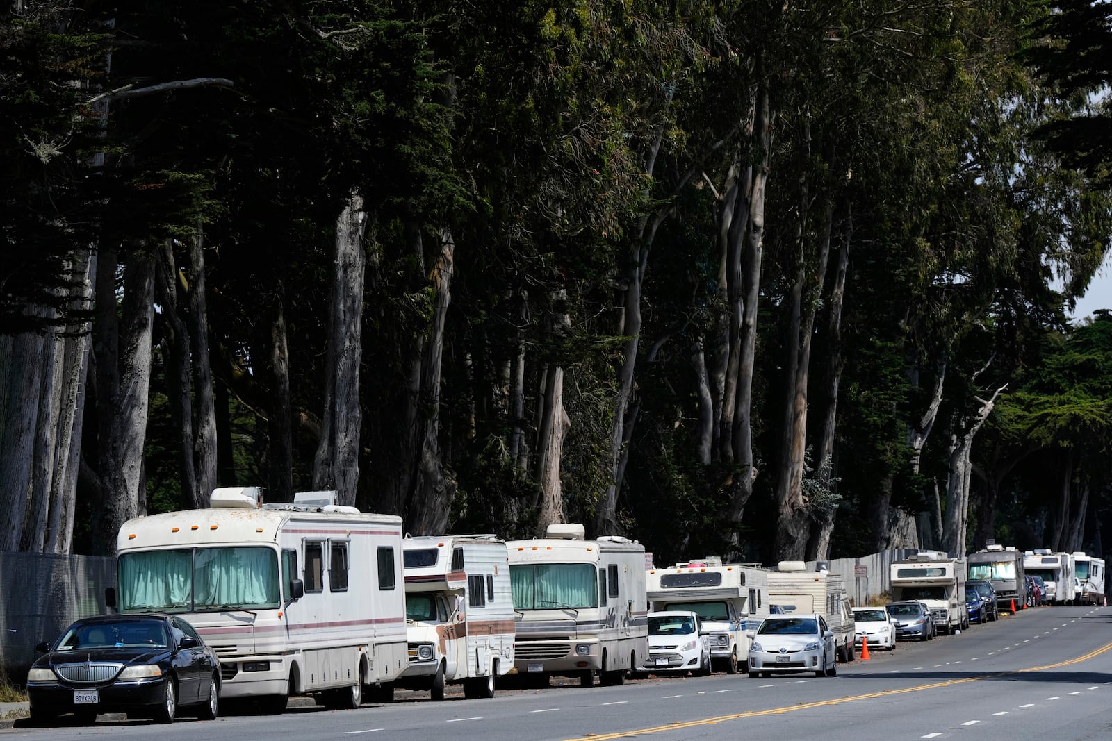 Parked RVs are seen on Lake Merced Boulevard in San Francisco, Tuesday, July 15, 2025. (AP Photo/Godofredo A. Vásquez)