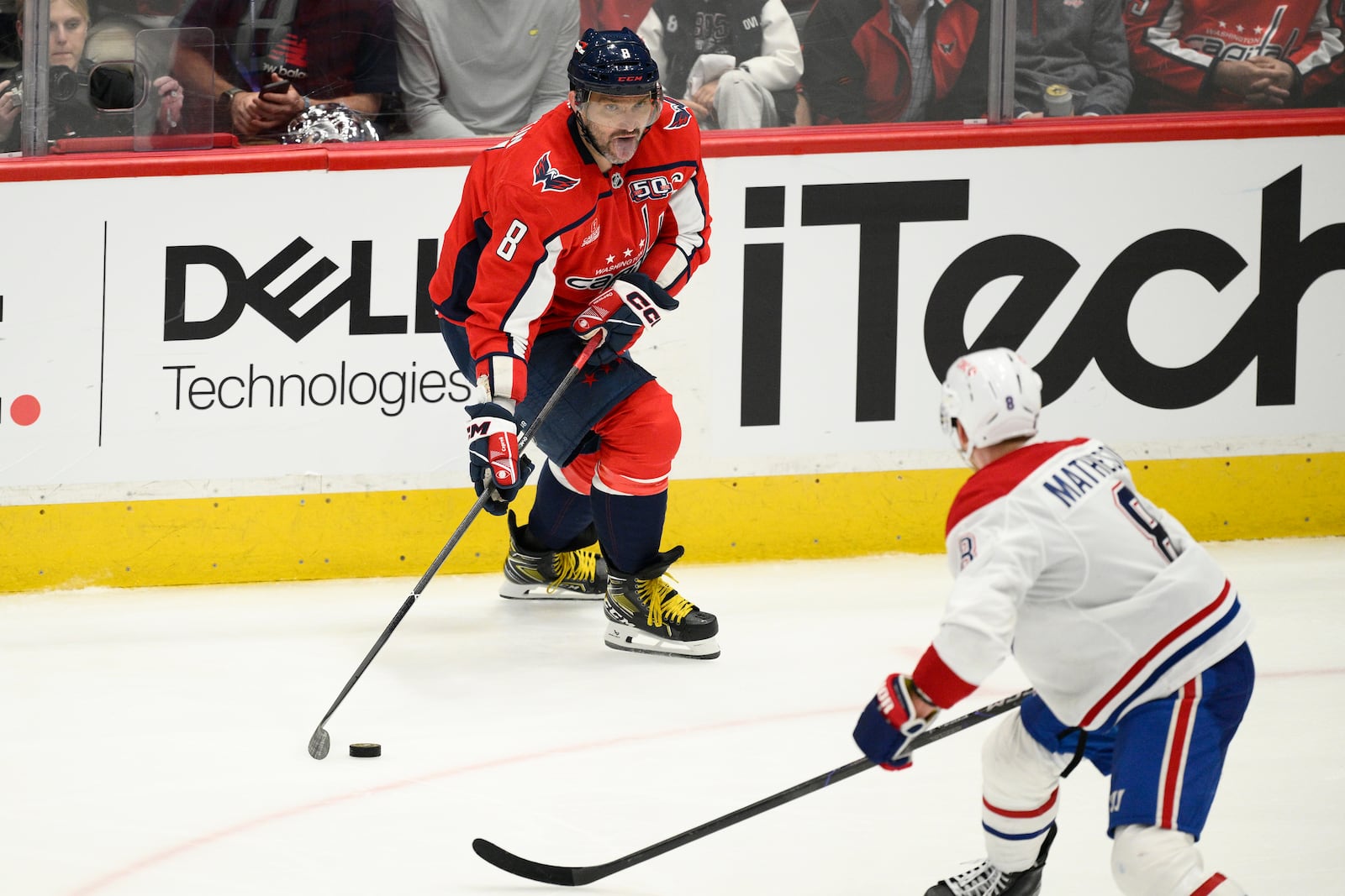 Washington Capitals left wing Alex Ovechkin, top, skates with the puck against Montreal Canadiens defenseman Mike Matheson, bottom, in the third period of Game 2 of a first-round NHL hockey playoff series Wednesday, April 23, 2025, in Washington. (AP Photo/Nick Wass)