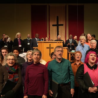 Faith leaders and members of the World House Choir sing at St. John Missionary Baptist Church in Springfield, Ohio, on Monday, Feb. 2, 2026, during an event in support of Haitian migrants fearing the end of their Temporary Protected Status in the U.S. (AP Photo/Luis Andres Henao)
