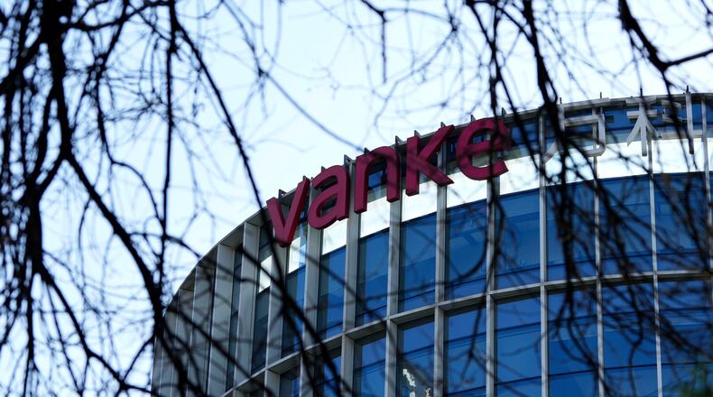The Vanke logo is seen on a commercial complex in Beijing, China, Wednesday, Dec. 24, 2025. (AP Photo/Ng Han Guan)