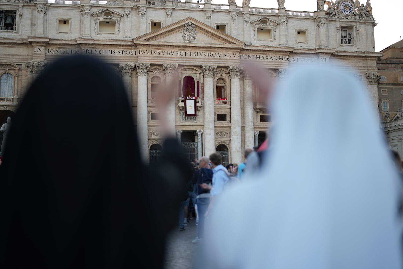 Nuns react during the speech of the newly elected Pope Leo XIV at the Vatican, Thursday, May 8, 2025. (AP Photo/Francisco Seco)