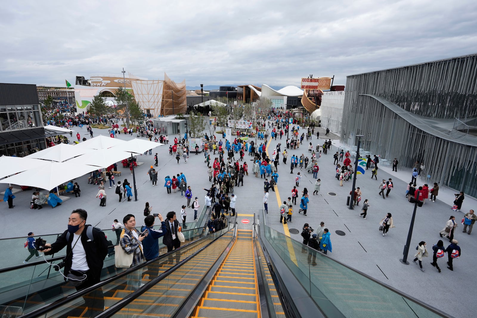 People visit the opening day of the Expo 2025 in Osaka, central Japan, Sunday, April 13, 2025. (AP Photo/Hiro Komae)