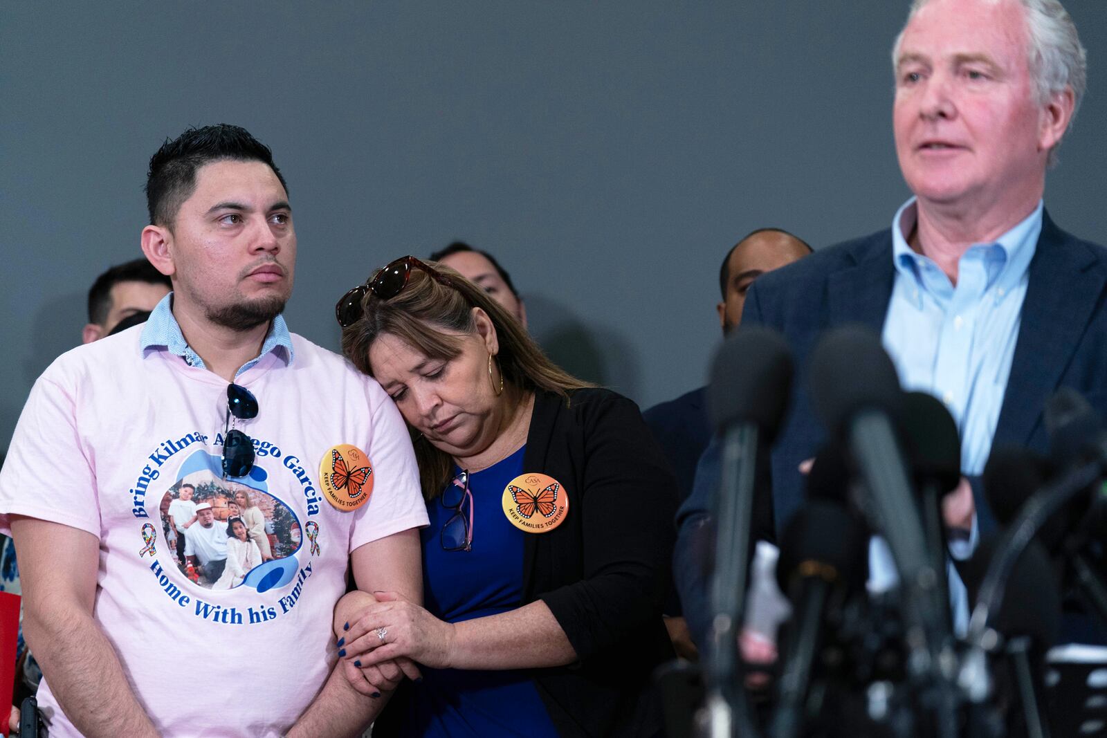 Sen. Chris Van Hollen, D-Md., accompanied by Cesar Abrego Garcia, from left, and Cecilia Garcia, speaks during a news conference upon his arrival from meeting with Kilmar Abrego Garcia in El Salvador, at Washington Dulles International Airport, in Chantilly, Va., Friday, April 18, 2025. (AP Photo/Jose Luis Magana)