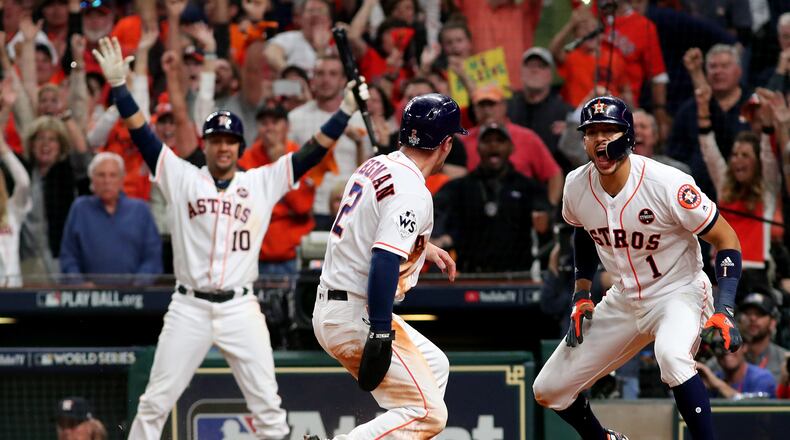 HOUSTON, TX - OCTOBER 29: Alex Bregman #2 of the Houston Astros celebrates after scoring on a double by Jose Altuve #27 (not pictured) during the seventh inning against the Los Angeles Dodgers in game five of the 2017 World Series at Minute Maid Park on October 29, 2017 in Houston, Texas. (Photo by Jamie Squire/Getty Images)