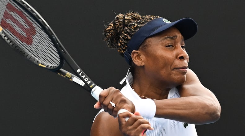 Venus Williams of the U.S. hits a backhand to Magda Linette of Poland during her singles match of the ASB Classic Women's Tennis Tournament in Auckland, New Zealand, Tuesday Jan. 6, 2026. (Andrew Cornaga/Photosport via AP)