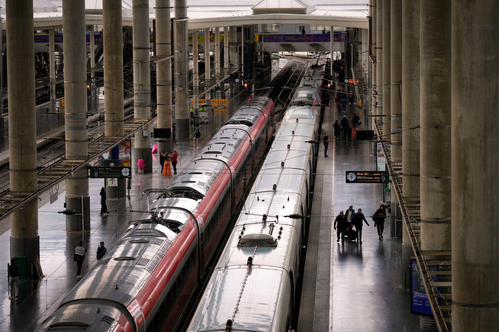 Trains are photographed on their platforms at the Madrid train station, Spain, Monday, May 5, 2025. (AP Photo/Manu Fernandez)