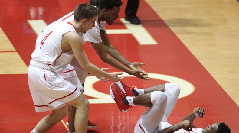 Wittenbergs Jordan Pumroy, front left, and Landon Martin, back left, help Rashaad Ali-Shakir up during a game against Misericordia in first round of NCAA tournament on Friday, March 2, 2018, at Pam Evans Smith Arena in Springfield. David Jablonski/Staff
