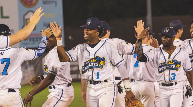 Springfield High School graduate Kawambee Moss (1) is one of two Springfield natives are pursuing their dreams this summer as part of a collegiate summer baseball team s record-breaking season. Moss and Shawnee High School graduate Lukas Moore are both members of the Kalamazoo Growlers, a member of the 20-team Northwoods League.