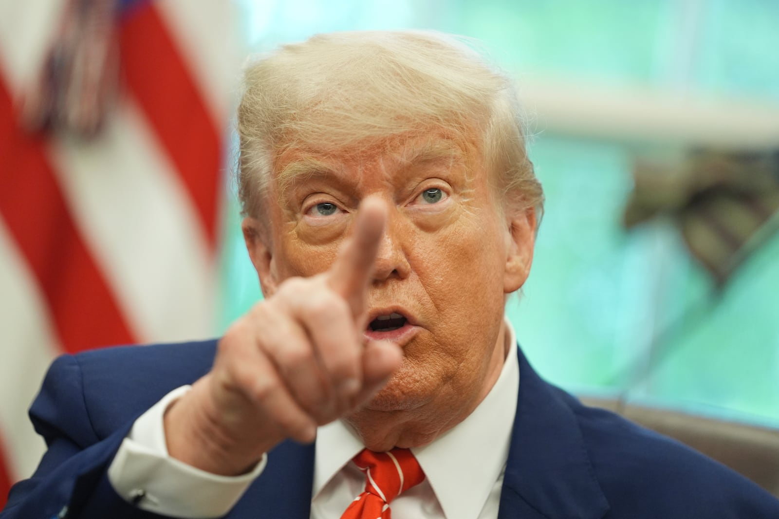 President Donald Trump gestures as he speaks with reporters after announcing a trade deal with United Kingdom in the Oval Office of the White House, Thursday, May 8, 2025, in Washington. (AP Photo/Evan Vucci)